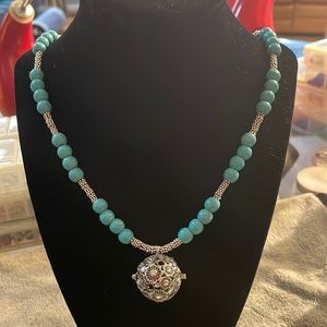 Genuine turquoise beads with sterling silver and pendant is essentials too.